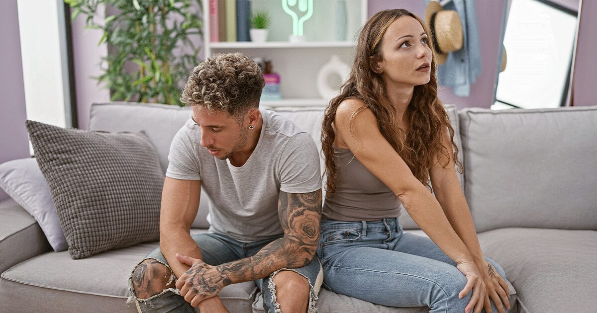 Distressed couple disagreeing after the woman feels pressured to have an abortion.